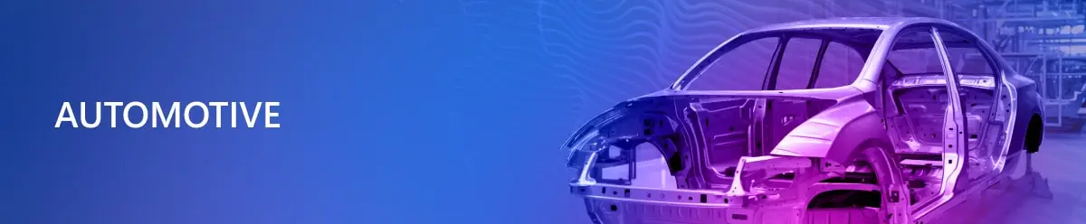 Напис “Automotive” на синьому фоні і справа каркас автомобіля на виробництві автомобілів